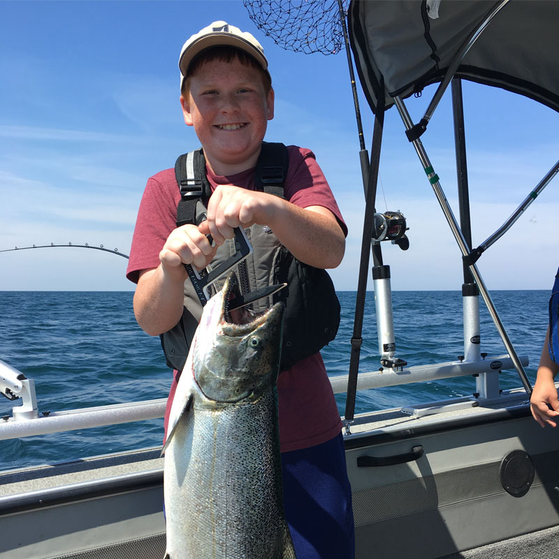 Boy fish boat